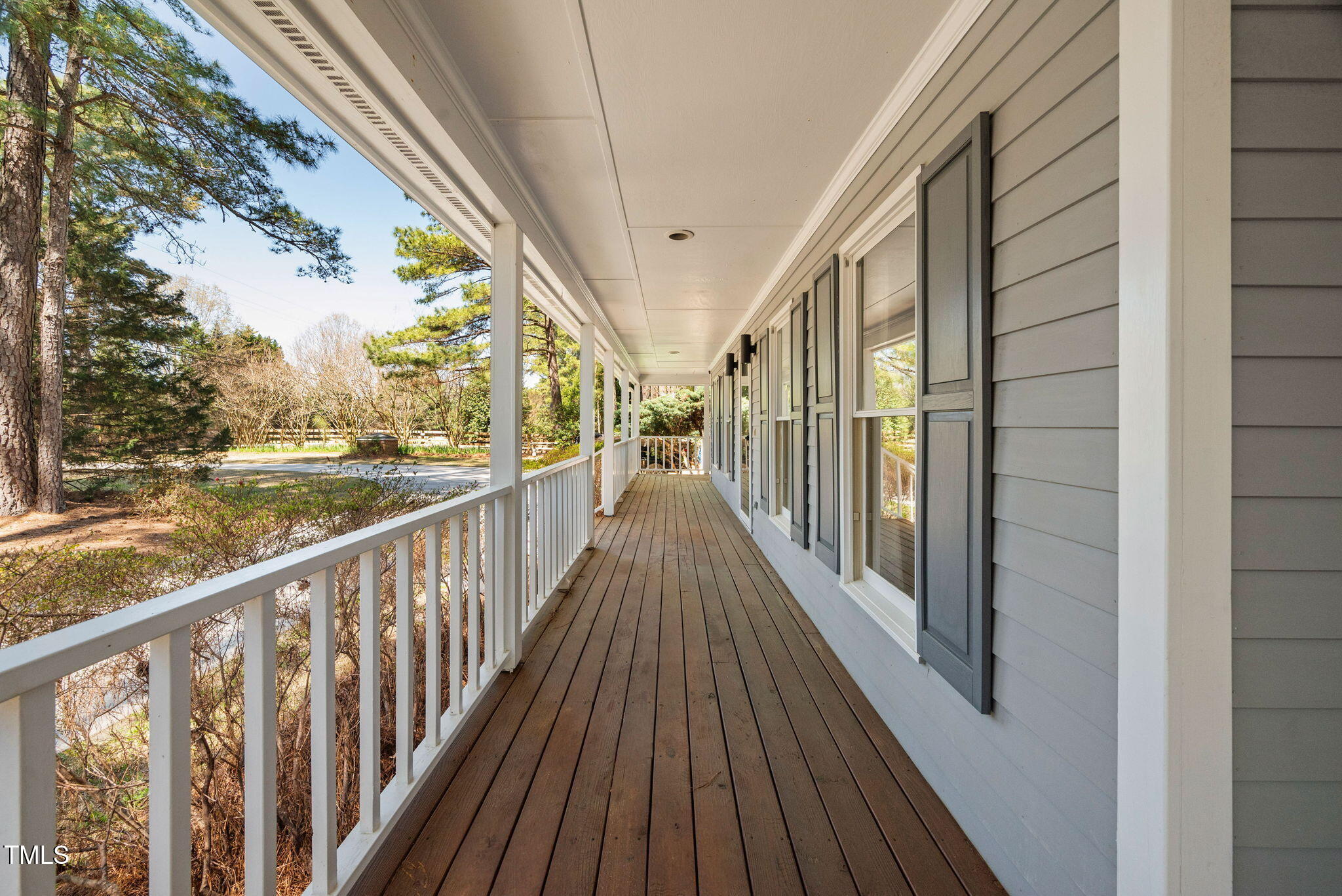 7917 Blaney Franks Road Apex, NC 27539 - Photo 28 of 50 a view of a balcony with wooden floor