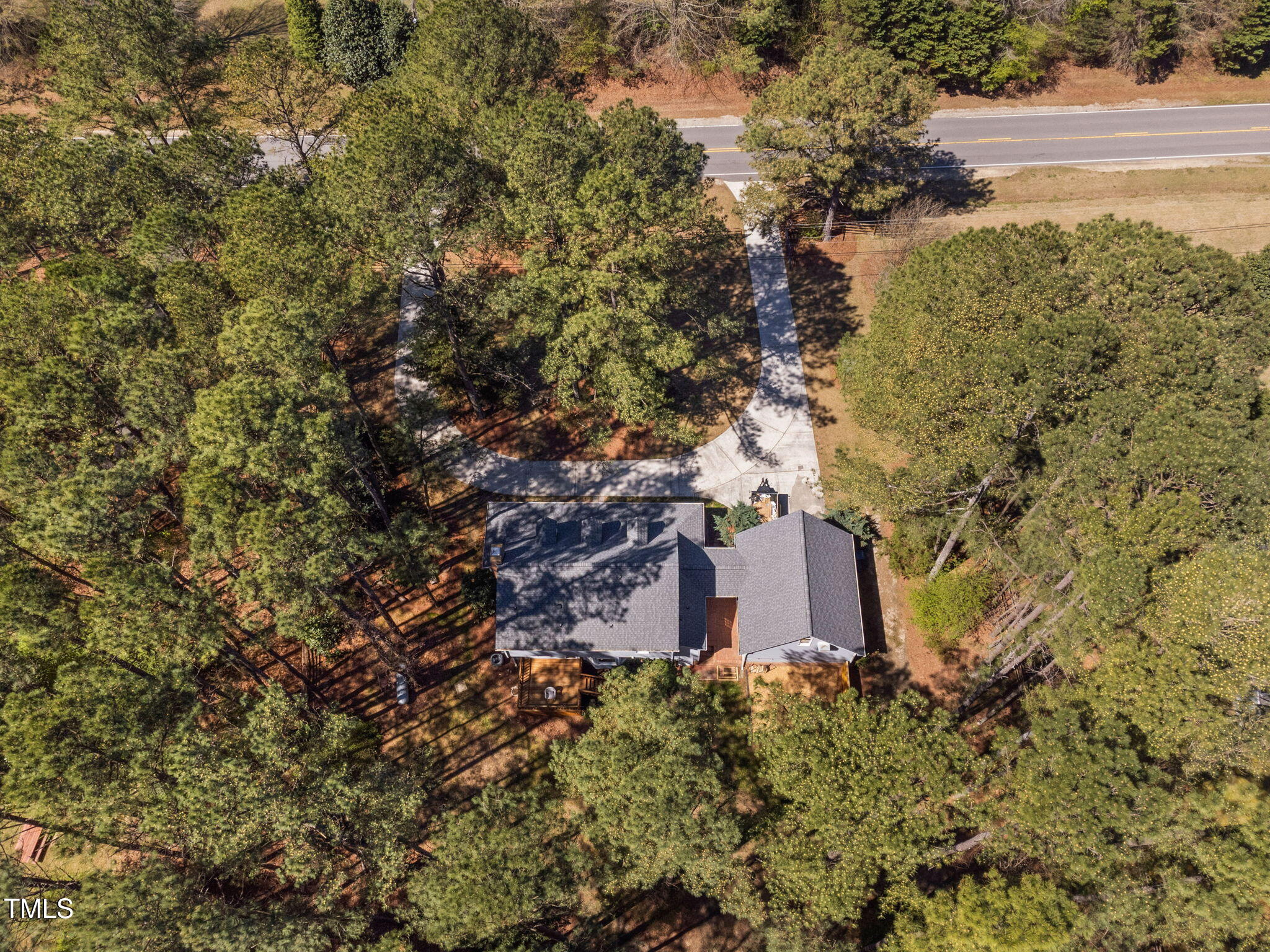 7917 Blaney Franks Road Apex, NC 27539 - Photo 47 of 50 a view of a wooden door with a tree