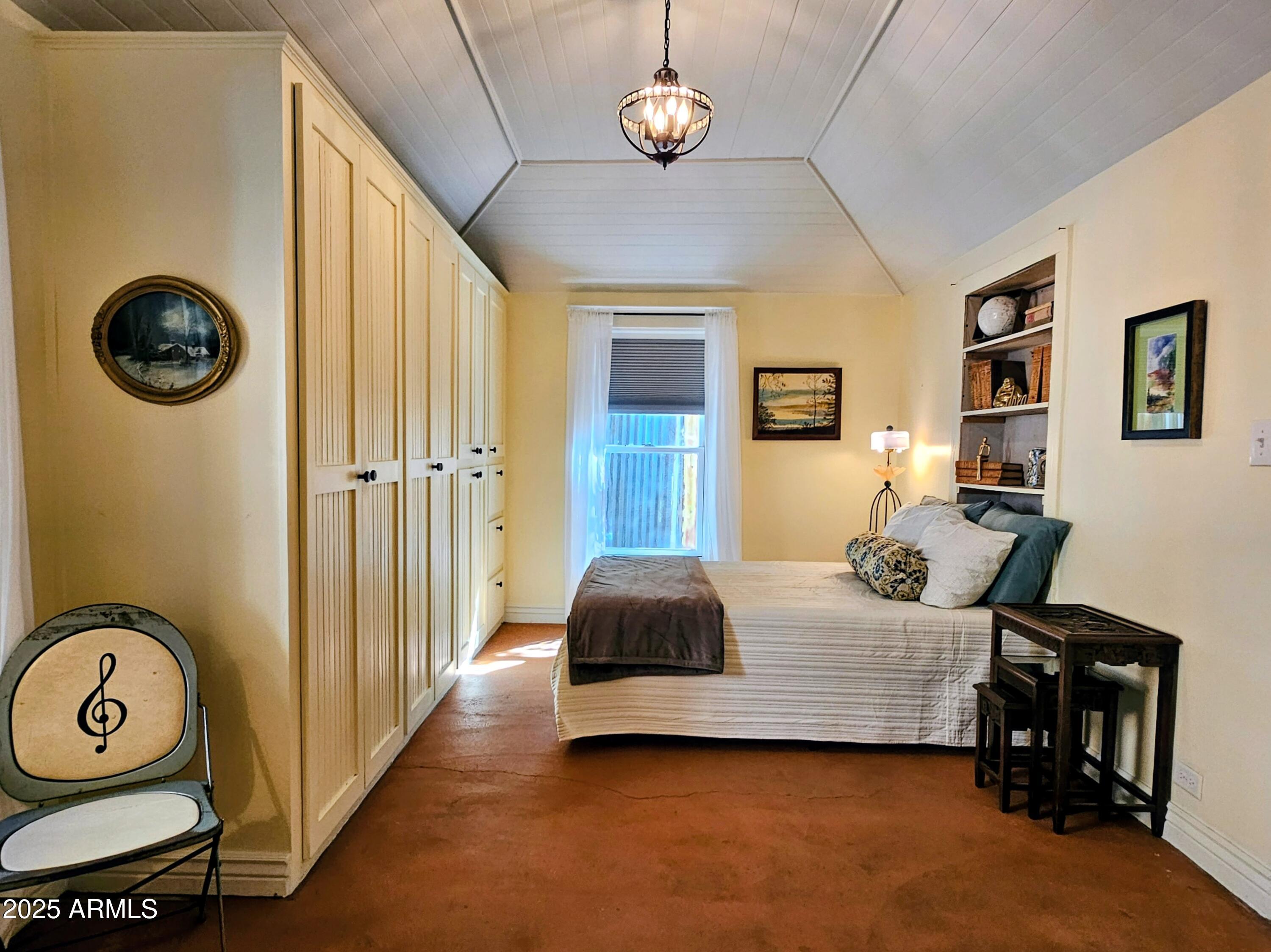 79 Ok Street Bisbee, AZ 85603 - Photo 21 of 33 a bedroom with bed and a window