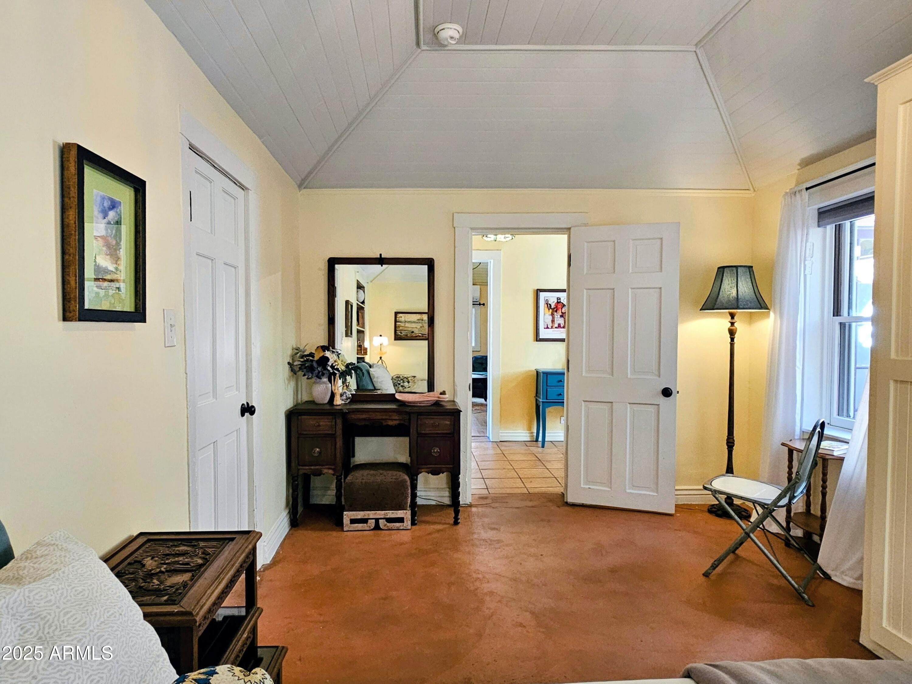 79 Ok Street Bisbee, AZ 85603 - Photo 23 of 33 a bedroom with furniture and a window