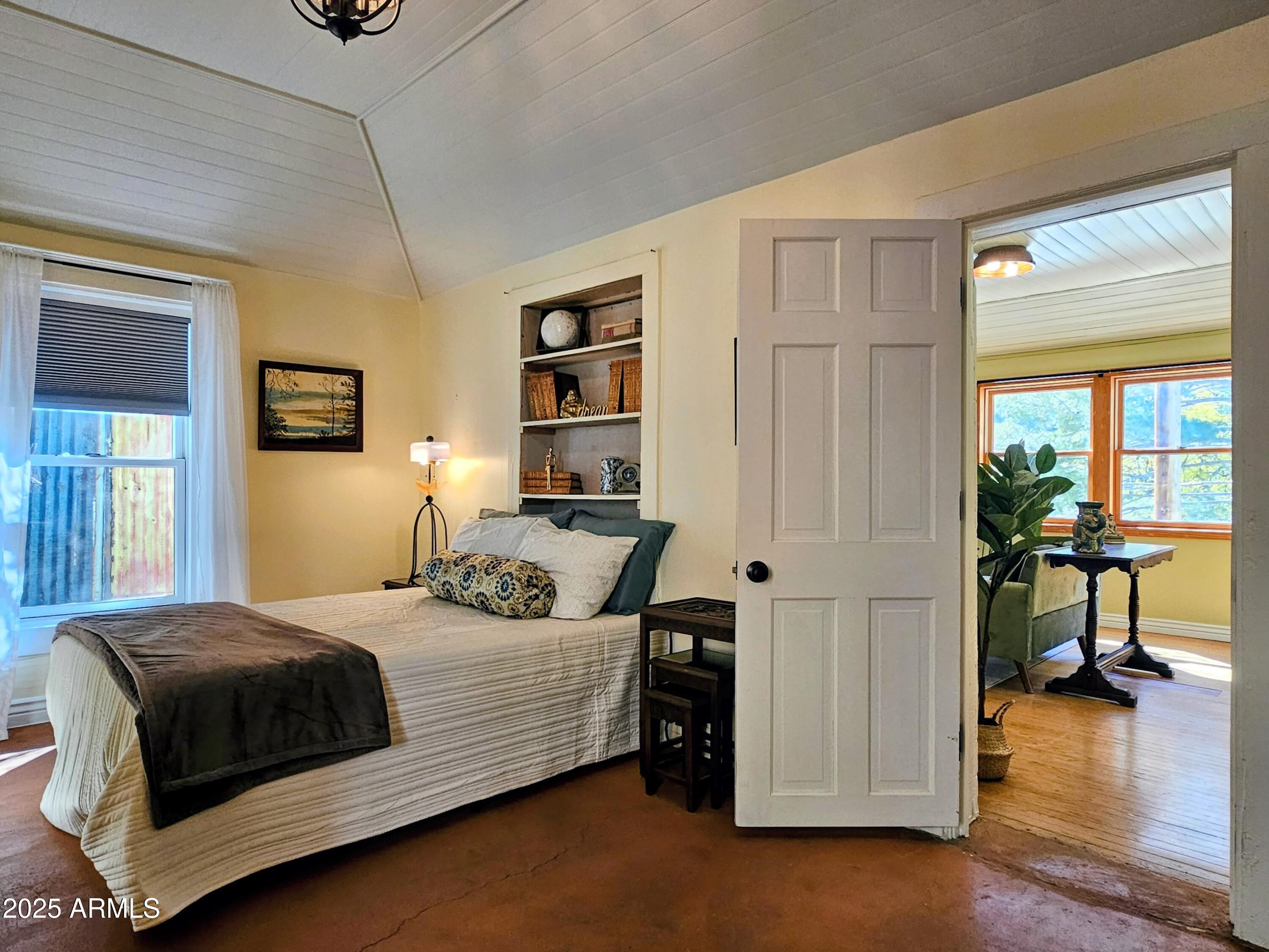 79 Ok Street Bisbee, AZ 85603 - Photo 24 of 33 a bedroom with a bed and a table