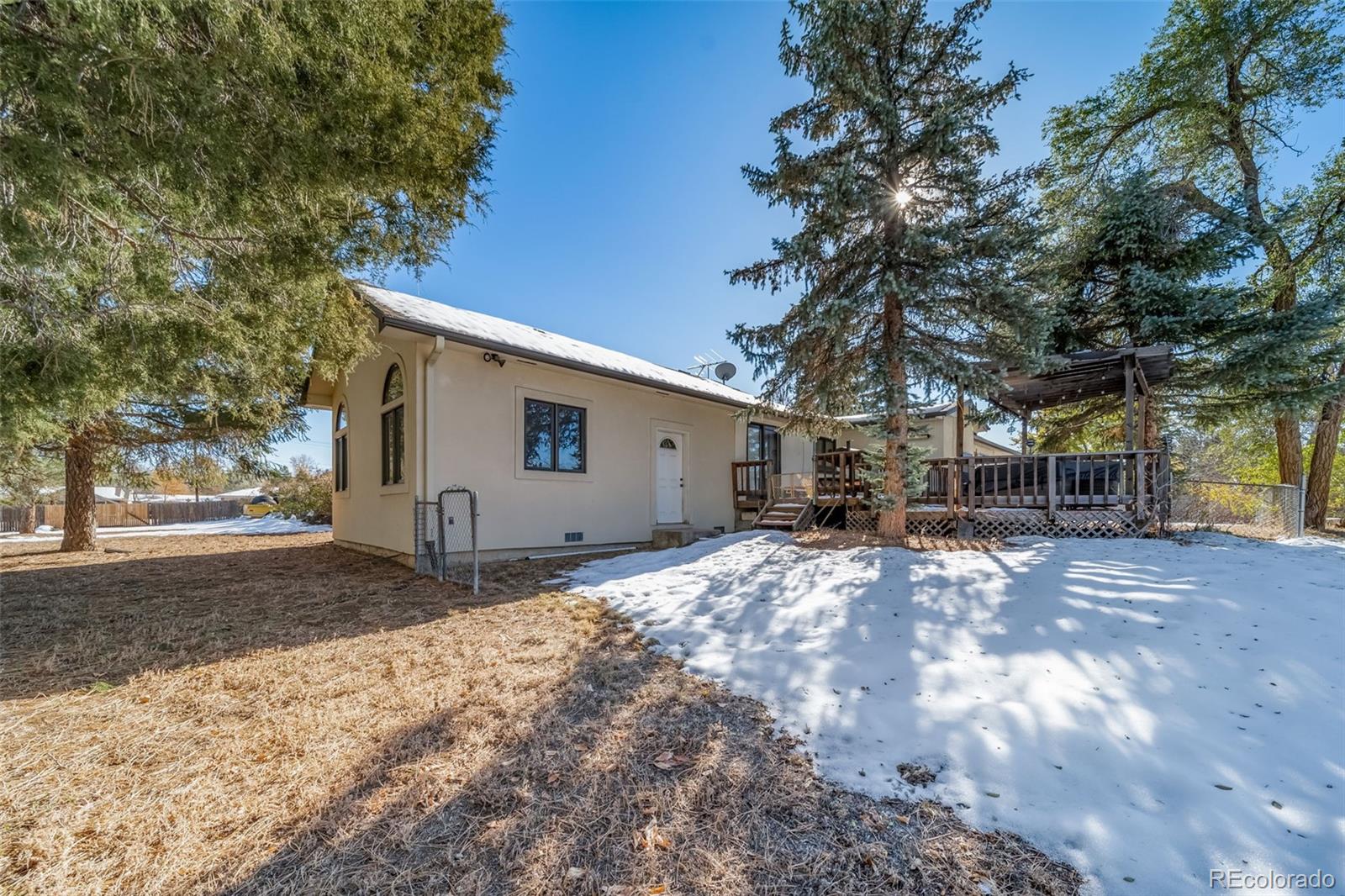 6101 South University Boulevard Centennial, CO 80121 - Photo 47 of 50 a front view of house with yard and trees