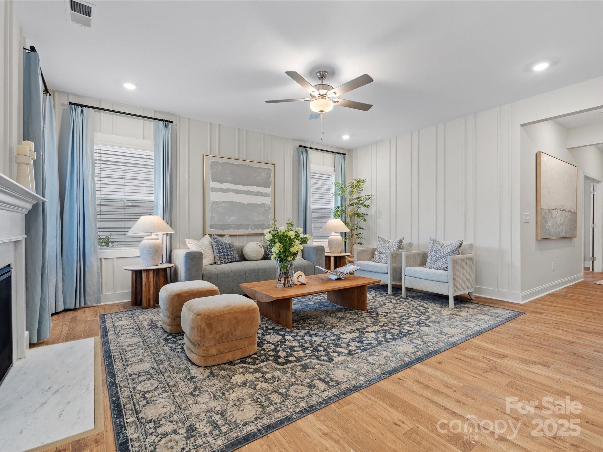 1016 Broken Spur Road Indian Trail, NC 28079 - Photo 3 of 19 a living room with furniture and a chandelier