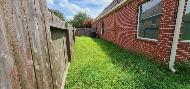a backyard of a house with lots of green space