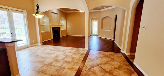 a view of a hallway with furniture and a living room