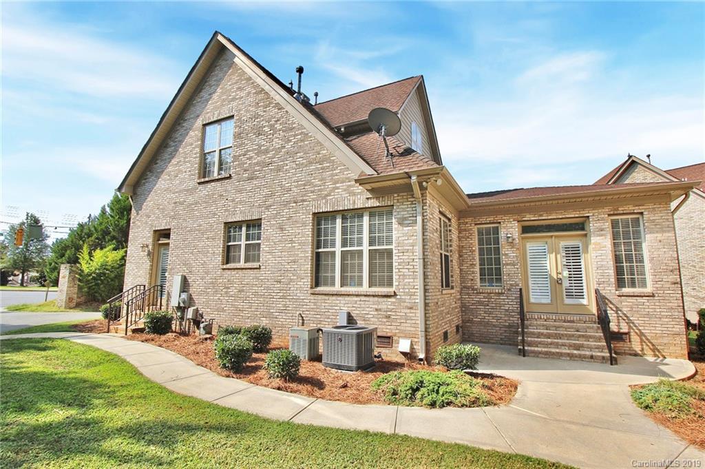 4608 McKee Road Charlotte, NC 28270 - Photo 2 of 32 a front view of a house with a yard