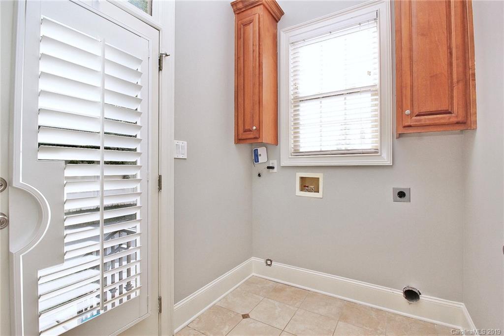 4608 McKee Road Charlotte, NC 28270 - Photo 15 of 32 a bathroom with a window and a shower