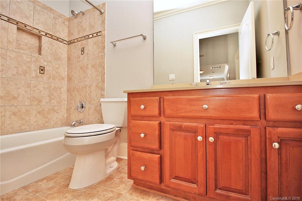 4608 McKee Road Charlotte, NC 28270 - Photo 24 of 32 a bathroom with a toilet a sink and a bathtub