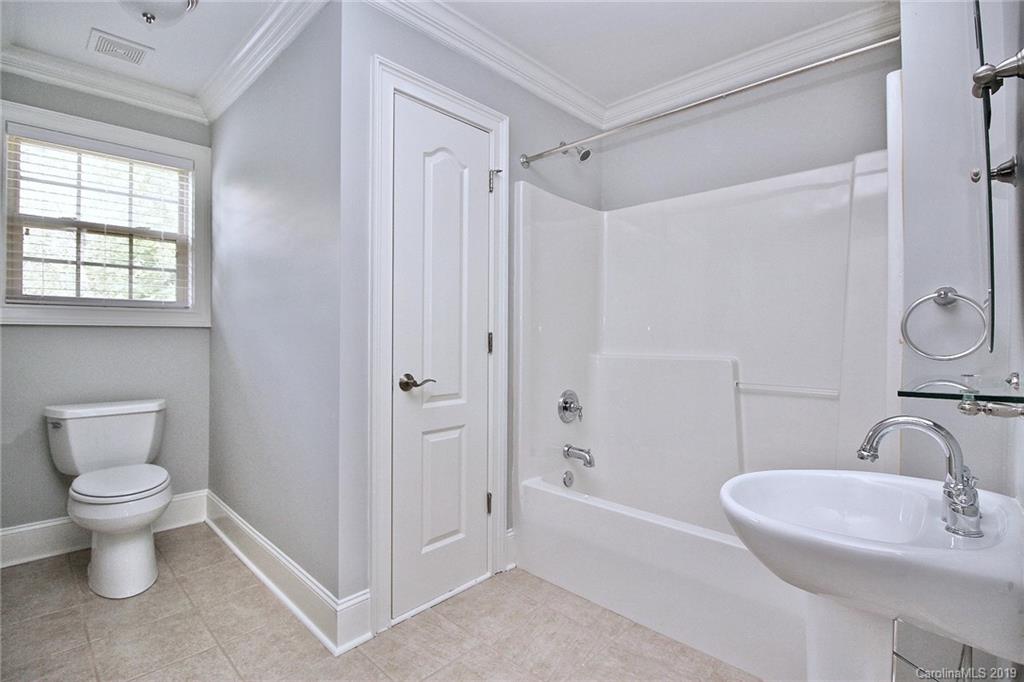 4608 McKee Road Charlotte, NC 28270 - Photo 31 of 32 a bathroom with a sink toilet and shower