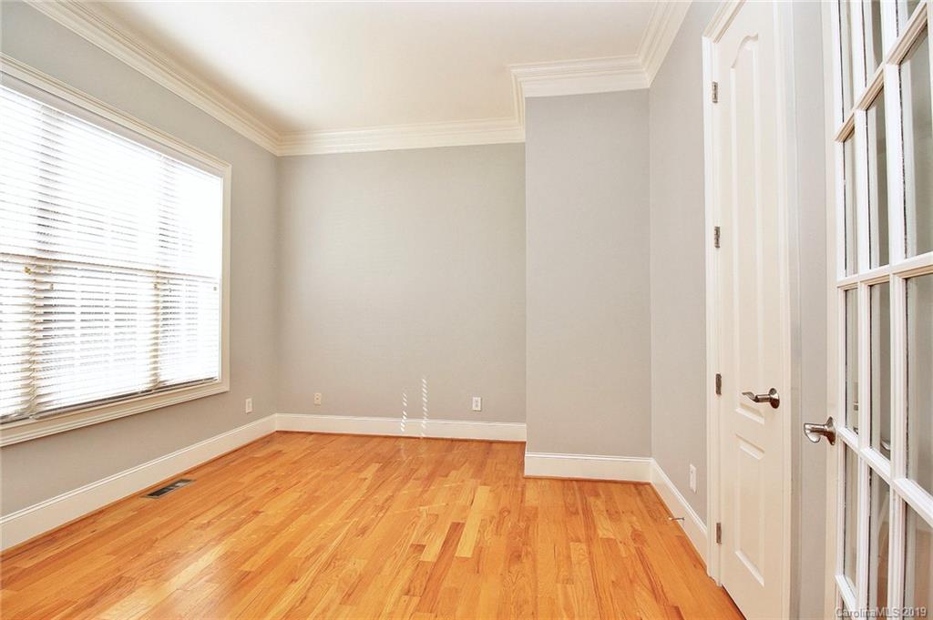 4608 McKee Road Charlotte, NC 28270 - Photo 6 of 32 a view of a room with wooden floor and a window