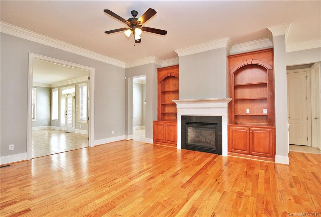4608 McKee Road Charlotte, NC 28270 - Photo 7 of 32 wooden floor fireplace and windows in an empty room