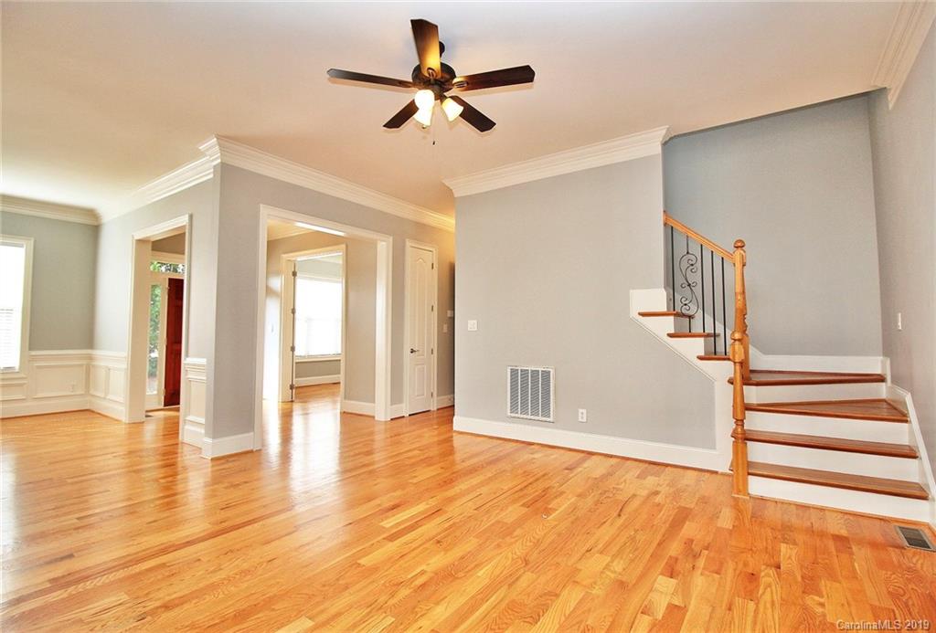 4608 McKee Road Charlotte, NC 28270 - Photo 8 of 32 a view of empty room with wooden floor and fan