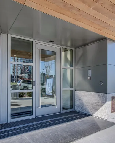 a view of a hallway with glass door