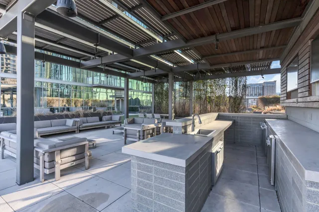 a outdoor space with lots of tables a garden view and chairs