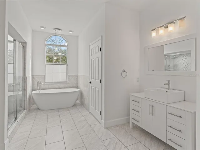 a bathroom with a bathtub and shower