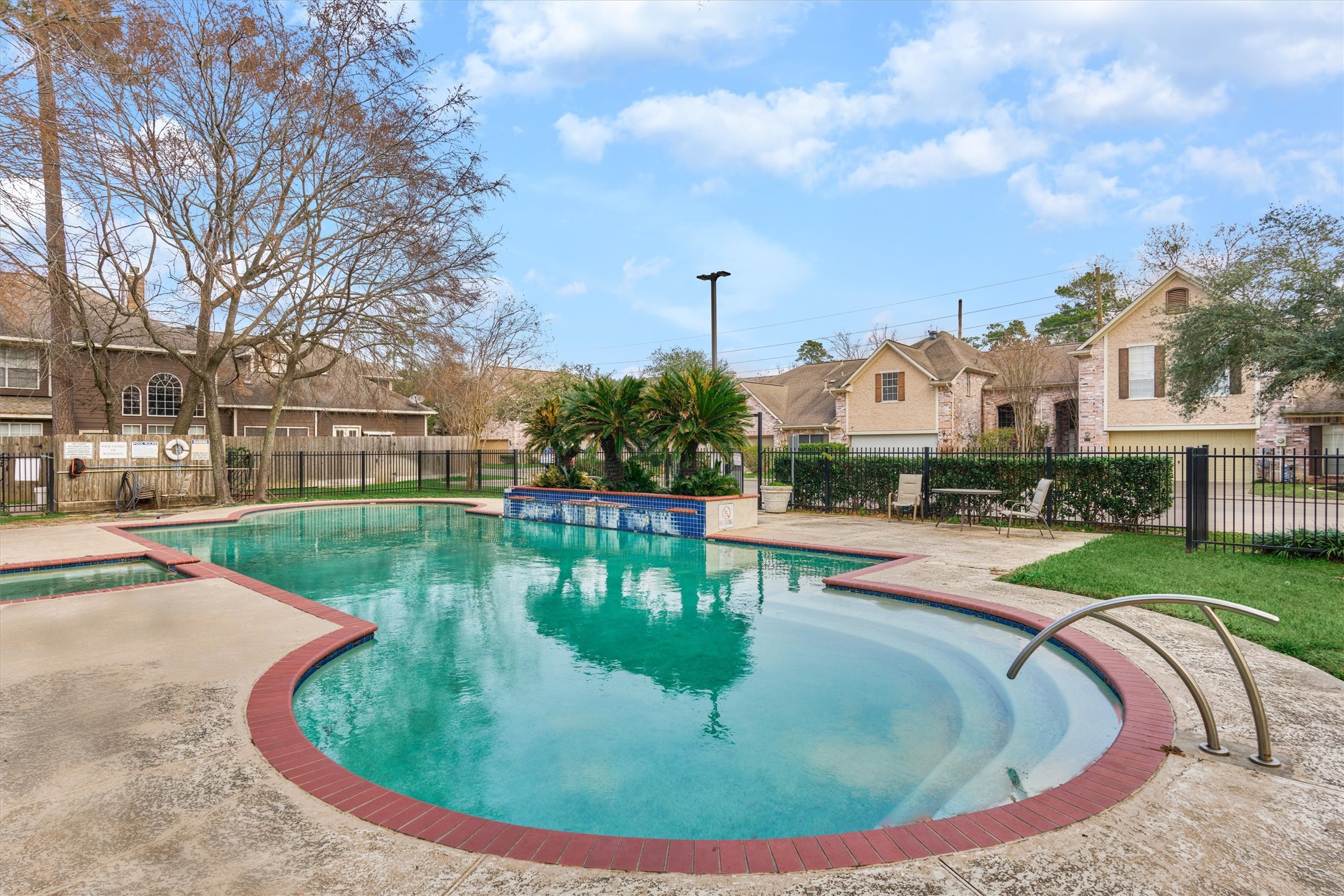 14420 Walters Road, Unit 26 Houston, TX 77014 - Photo 44 of 45 Enjoy the luxury of a community pool just steps away from Unit #26, perfect for relaxation and social gatherings.