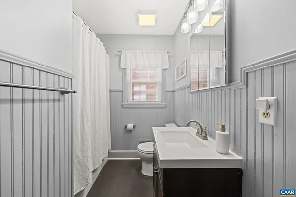 a spacious bedroom with two beds and a couch