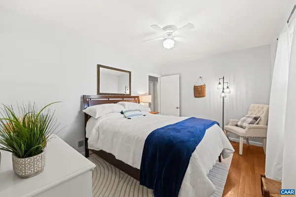 a view of kitchen with furniture and a refrigerator