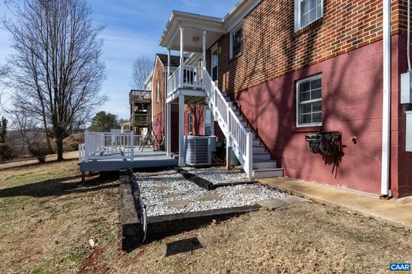 a view of balcony with wooden floor and fence