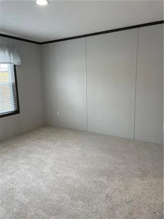 an empty room with a empty space and window