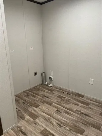 a view of a room with rack and wooden floor
