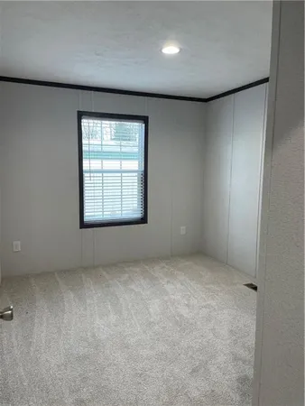 an empty room with a empty space and windows