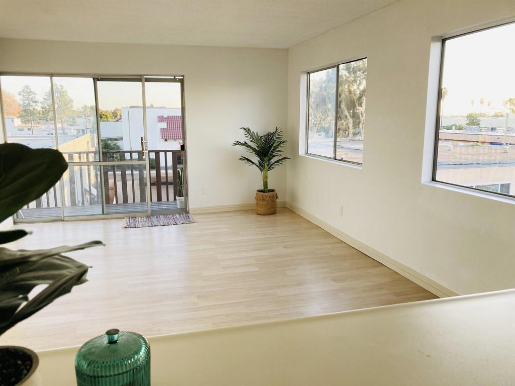 a view of a living room and floor to ceiling window