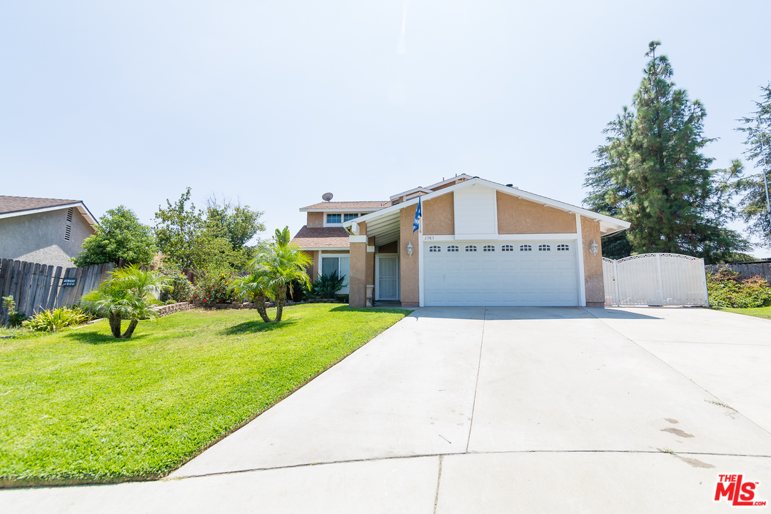 2985 North Chestnut Street Rialto, CA 92376 - Photo 2 of 30 a front view of a house with garden