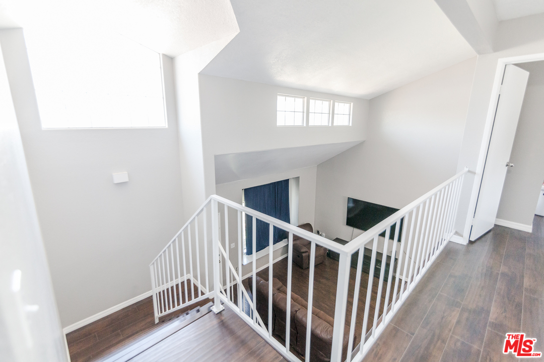 2985 North Chestnut Street Rialto, CA 92376 - Photo 25 of 30 a view of staircase with wooden floor and stairs