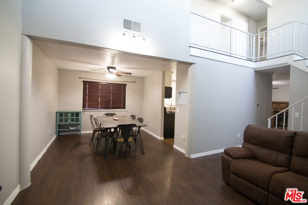 2985 North Chestnut Street Rialto, CA 92376 - Photo 8 of 30 a dining room with furniture and wooden floor