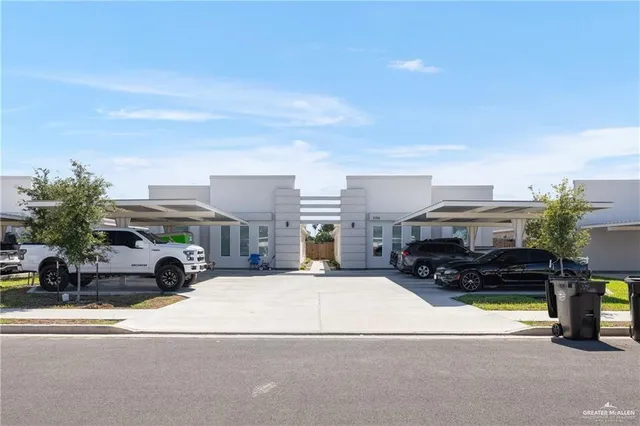 a view of multiple houses with yard