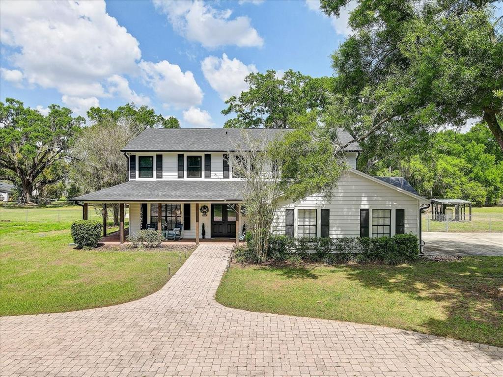 front view of a house with a yard