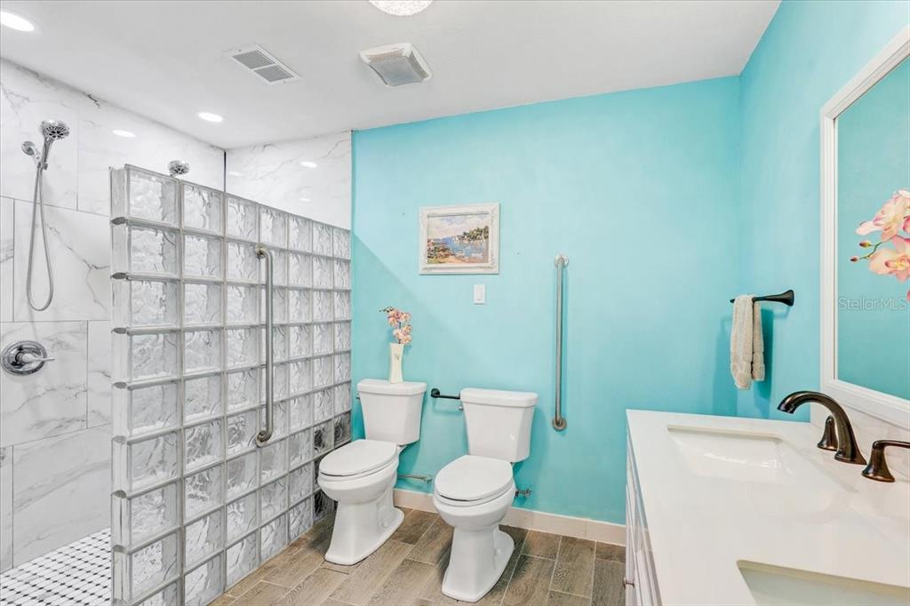 4710 Stearns Road Valrico, FL 33596 - Photo 21 of 63 a bathroom with a toilet sink and shower