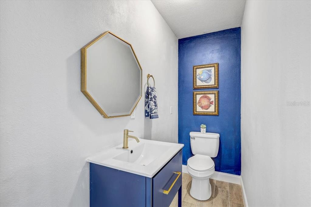 4710 Stearns Road Valrico, FL 33596 - Photo 25 of 63 a bathroom with a toilet a sink and mirror