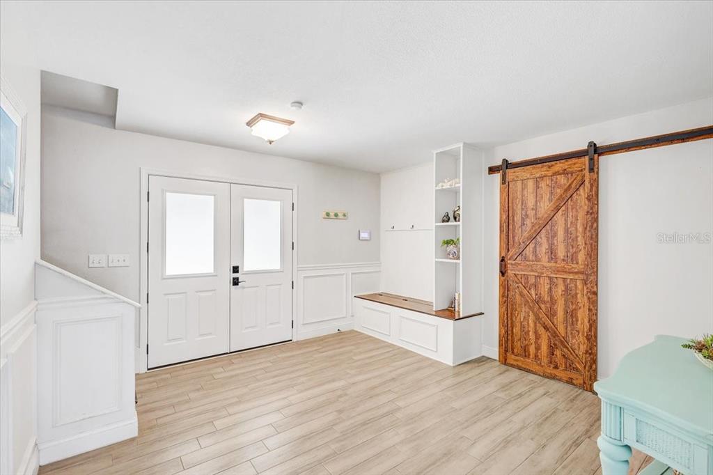 4710 Stearns Road Valrico, FL 33596 - Photo 27 of 63 a view of empty room with wooden floor and fan