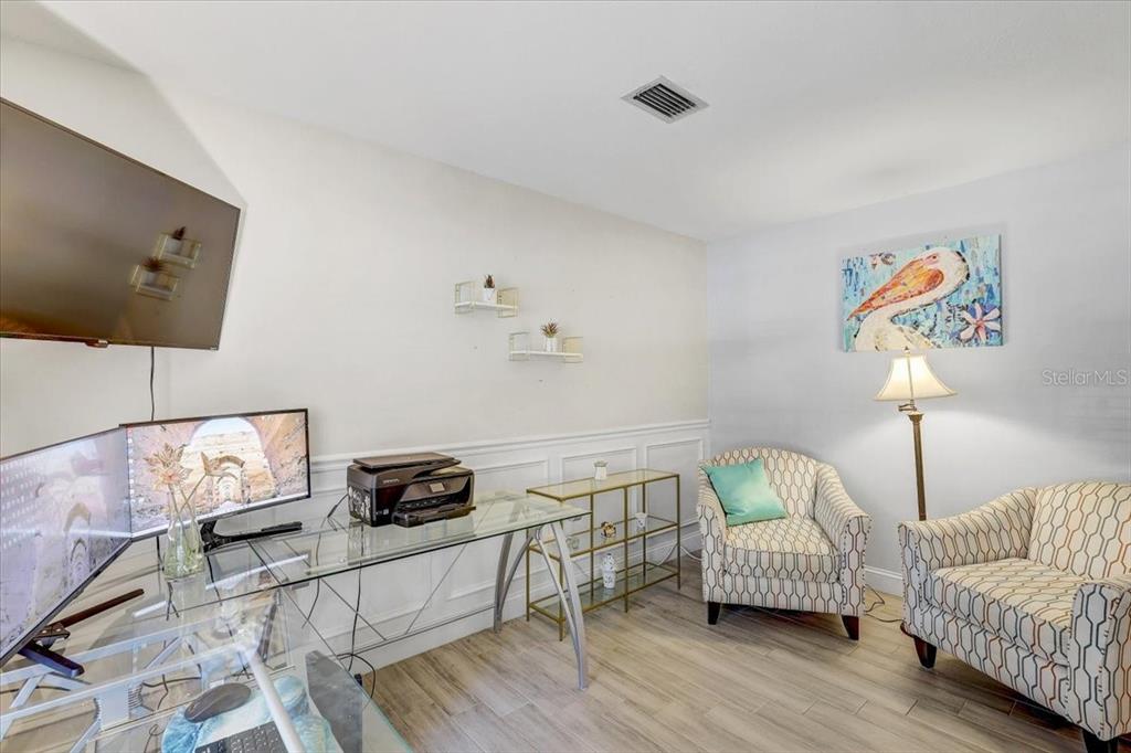 4710 Stearns Road Valrico, FL 33596 - Photo 28 of 63 a bedroom with furniture and a wooden floor