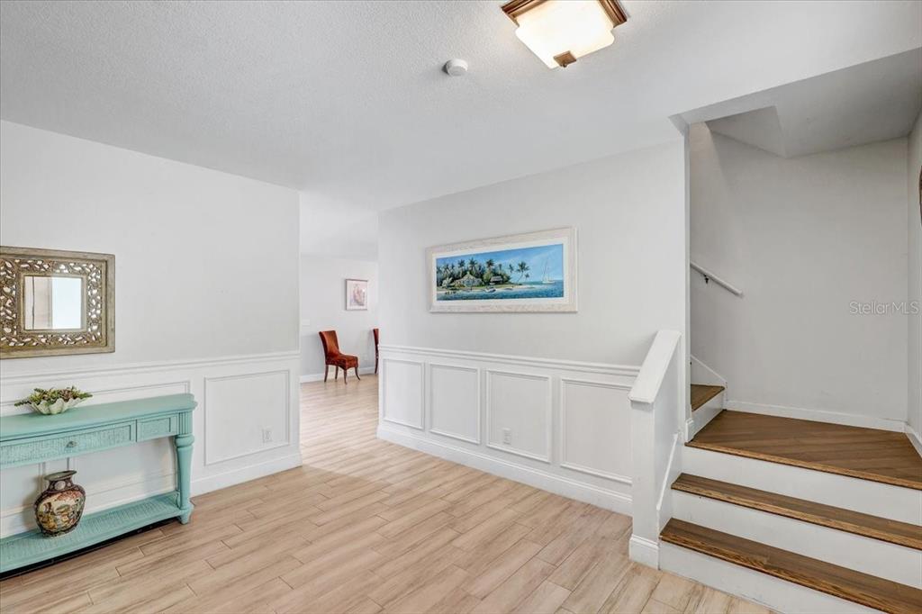 4710 Stearns Road Valrico, FL 33596 - Photo 29 of 63 a view of a livingroom with wooden floor and a ceiling fan