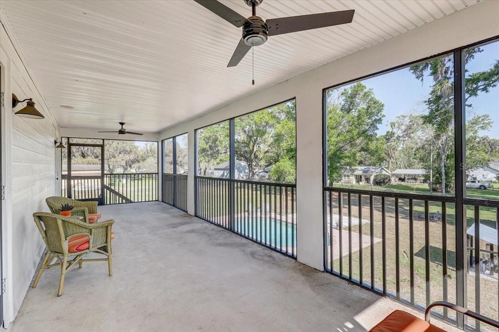 4710 Stearns Road Valrico, FL 33596 - Photo 38 of 63 a view of a hallway with furniture and chandelier