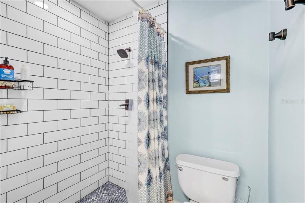 4710 Stearns Road Valrico, FL 33596 - Photo 46 of 63 a bathroom with a toilet and a shower