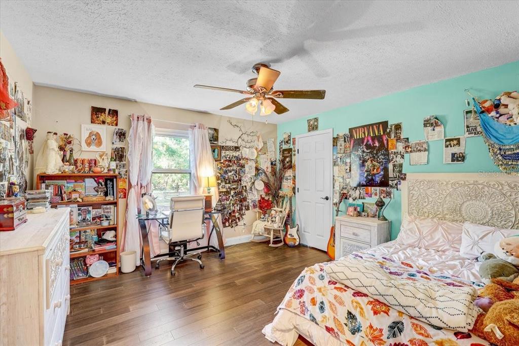 4710 Stearns Road Valrico, FL 33596 - Photo 50 of 63 a bedroom with a bed and a large window