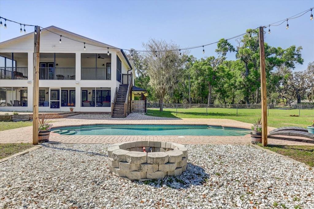 4710 Stearns Road Valrico, FL 33596 - Photo 56 of 63 a view of a house with a yard and a large tree park