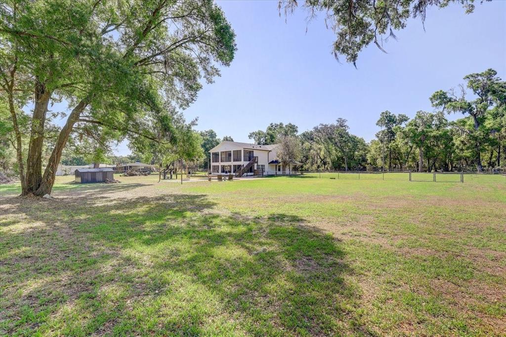 4710 Stearns Road Valrico, FL 33596 - Photo 61 of 63 a view of outdoor space with garden and trees