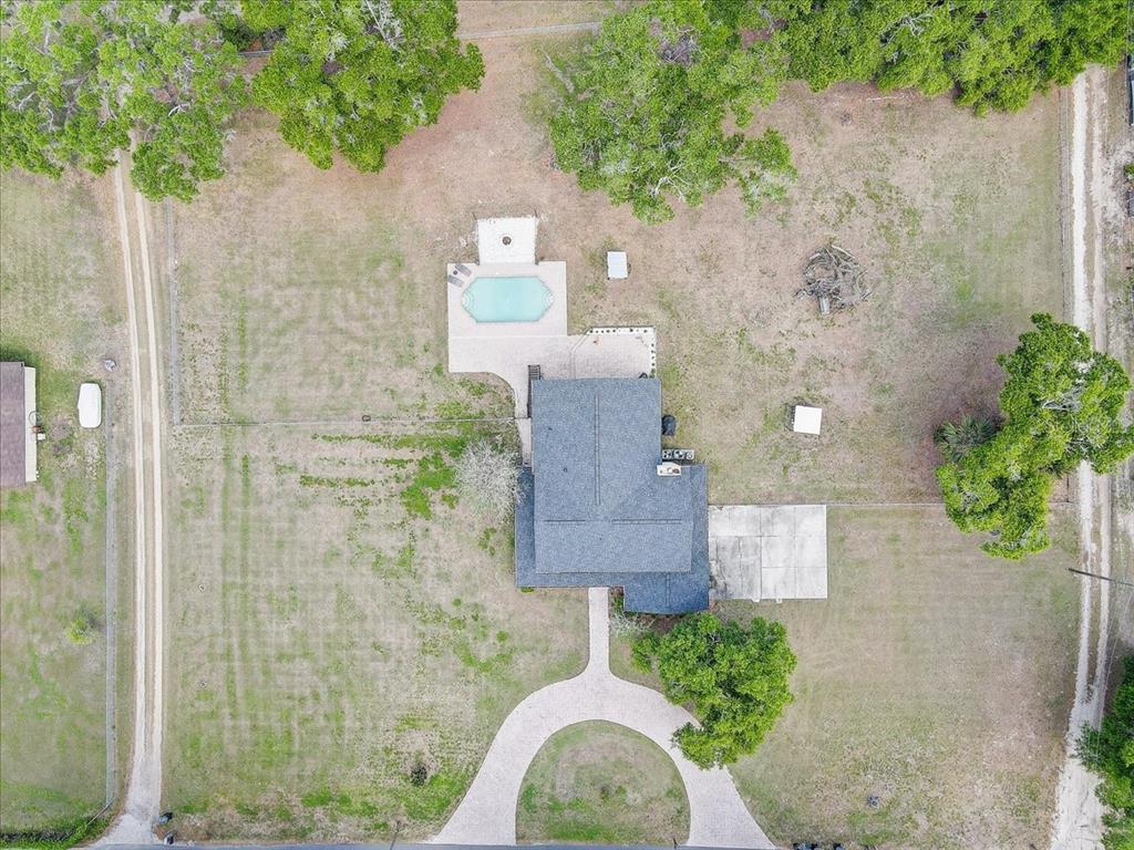 4710 Stearns Road Valrico, FL 33596 - Photo 62 of 63 an aerial view of a house with yard