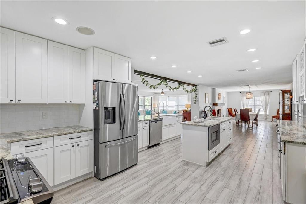 4710 Stearns Road Valrico, FL 33596 - Photo 8 of 63 a kitchen with a refrigerator and a stove top oven