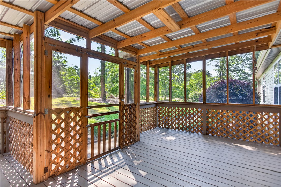151 Towne Creek Trail Anderson, SC 29621 - Photo 39 of 49 Enjoy nature's splendor from this comfortable screened porch, offering serene views.