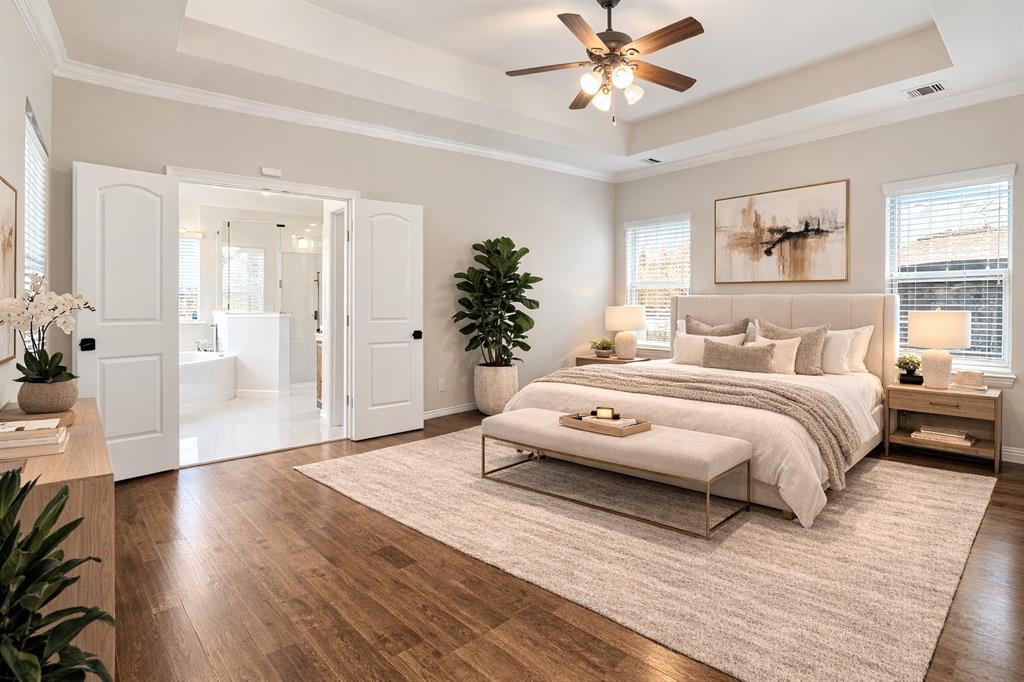 420 Prairie Run Aledo, TX 76008 - Photo 17 of 38 a spacious bedroom with a bed and a chandelier