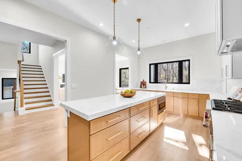a kitchen with a sink and a refrigerator