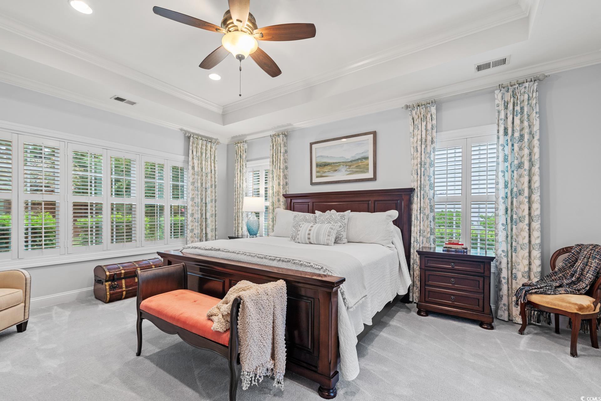 236 Chamberlin Road Myrtle Beach, SC 29588 - Photo 28 of 35 Bedroom with crown molding, multiple windows, carpet floors, a tray ceiling, and recessed lighting