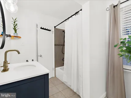 a bathroom with a sink and mirror