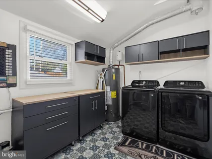 a kitchen with a refrigerator and a sink